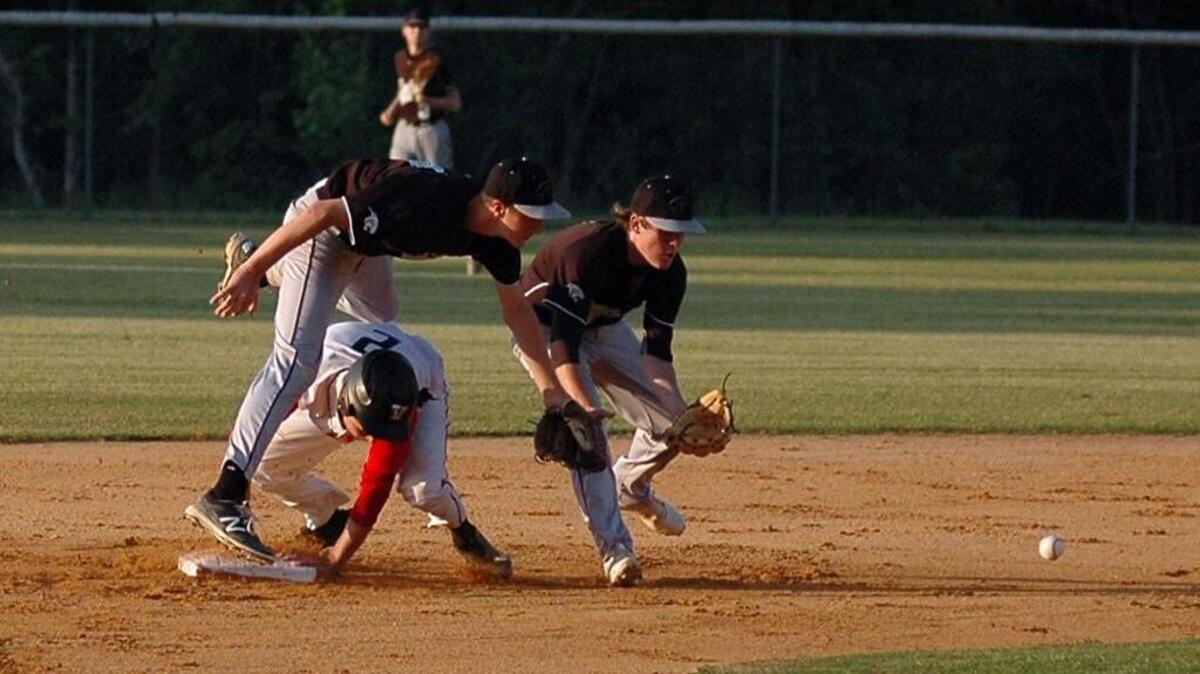 Voyager Academy's Chase Sykes (2) is safe at second base as he collides with Granville Central shortstop J.J. Tilley and Panthers teammate Carson Yancey awaits the ball on Monday, May 15, 2017 in Voyager's 5-0 win in the second round of the N.C. High School Athletic Association 1-A playoffs.