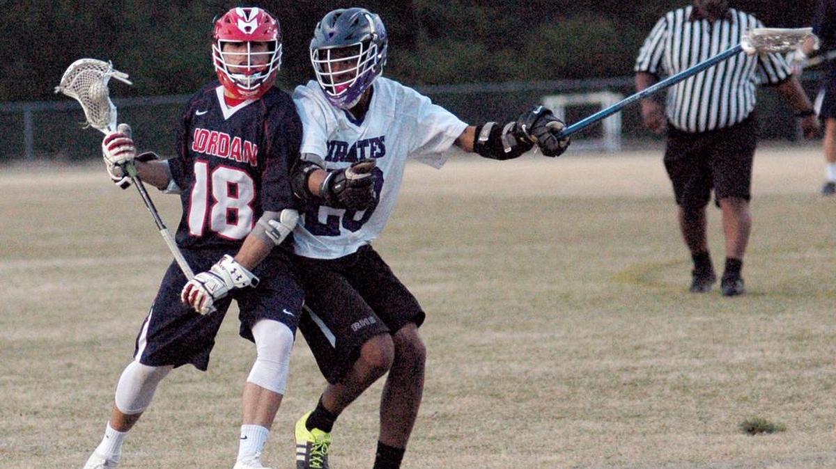 Jordan's Tyler Thompson (18) works for field position against Riverside's Jyles Ruff (20) in a boys' lacrosse match on Thursday, March 30, 2017 at Riverside. Jordan won 16-10.