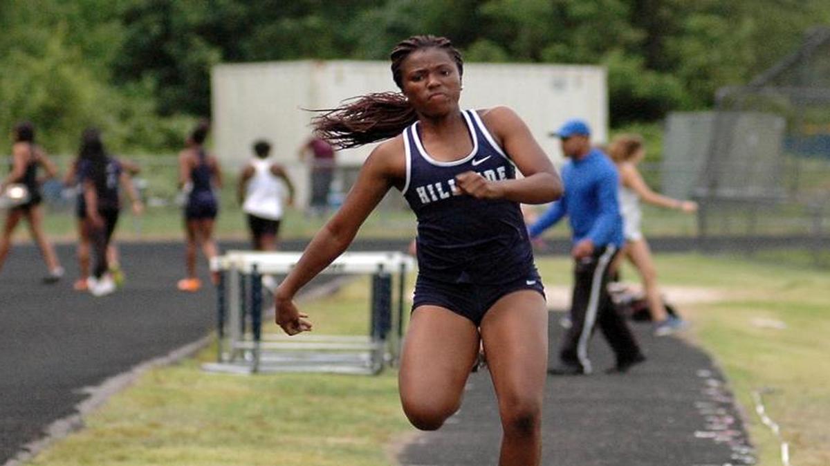 Triple jump winner Bailey McCray of Hillside bounds towards the pit on one of her attemps on Thusday, May 4, 2017 during the PAC-6 track championships at Hillside.