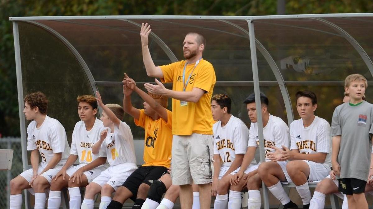 Jason Curtis, center, head coach of Chapel Hill reacts to a call during the first half. The Chapel Hill Tigers played the Marvin Ridge Mavericks in a men soccer game that counted for the NCHSAA 3A State Championship and took place at the N.C. State University Dail Stadium in Raleigh, N.C. on Saturday, November 19, 2016. Marvin Ridge won 1-0.