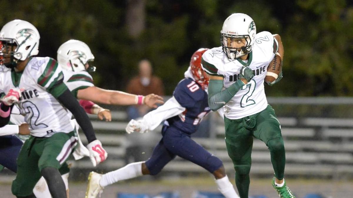 Jordyn Adams (2) of Green Hope carries the ball against the pursuit of Myles Speller (10) of Jordan. The Green Hope Falcons visited the Jordan Falcons in a high school football game on Oct. 27, 2017. Green Hope won 48-20.