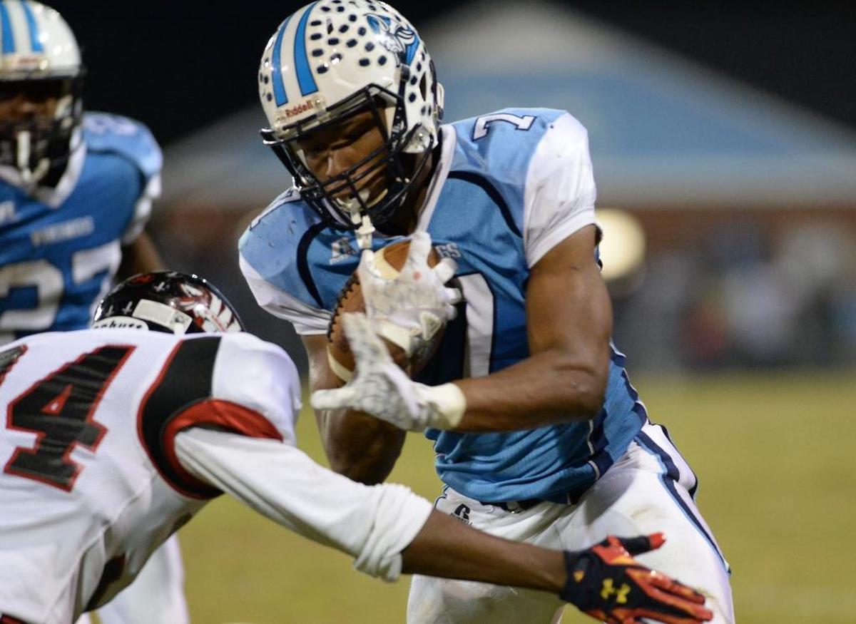 Allajah Mitchell (7) of South Granville avoids a tackle from Jerry Mayo (34) of J.F. Webb to score a touchdown for the Vikings. The J.F. Webb Warriors visited the South Granville Vikings in a high school football game on Nov. 3, 2017.