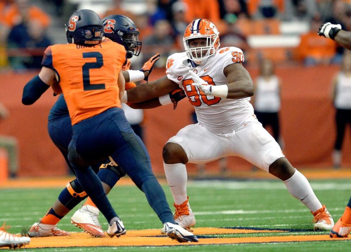 Clemson defensive tackle Dexter Lawrence, right, pressures Syracuse quarterback Eric Dungey on Oct. 13, in the Orange’s 27-24 upset win over the Tigers.