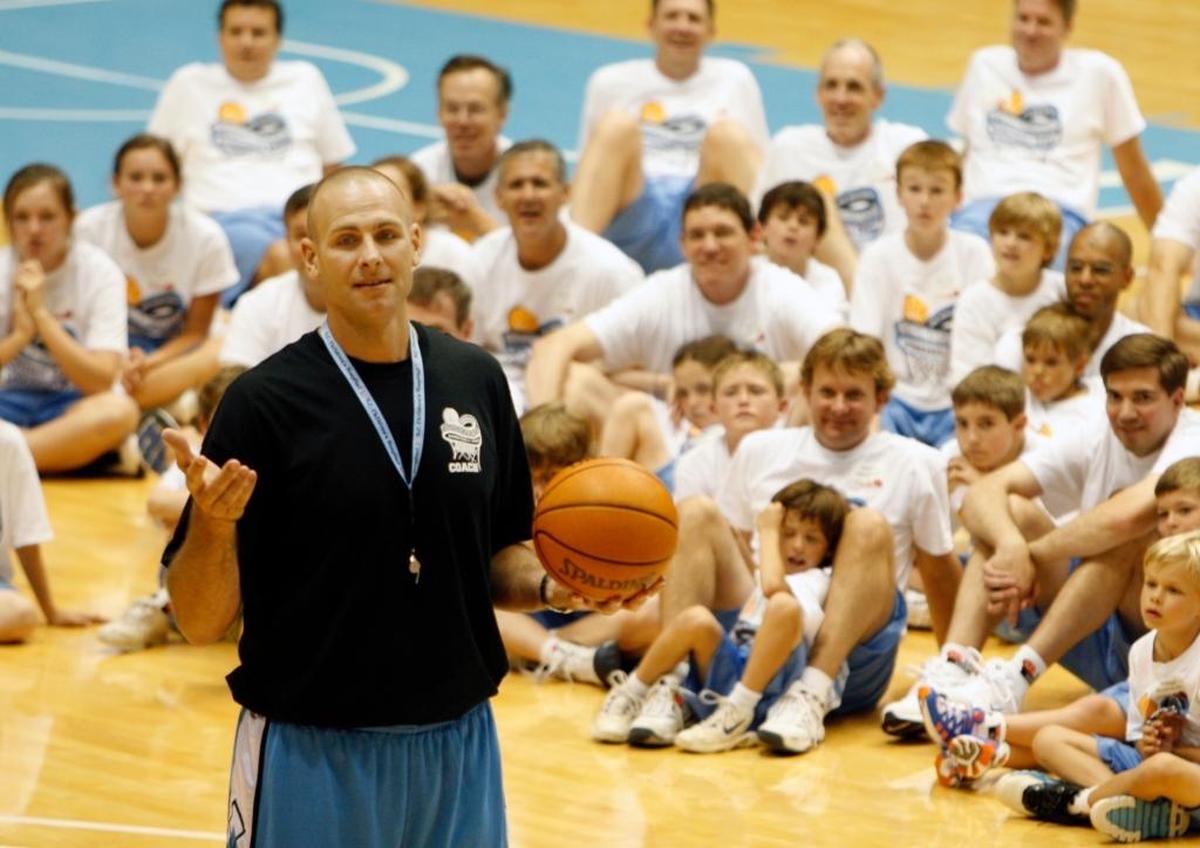 Former UNC basketball star Eric Montross speaks to an assembly of about 200 fathers and their kids in 2012 during the first day of the annual Eric Montross Father’s Day Basketball Camp.
