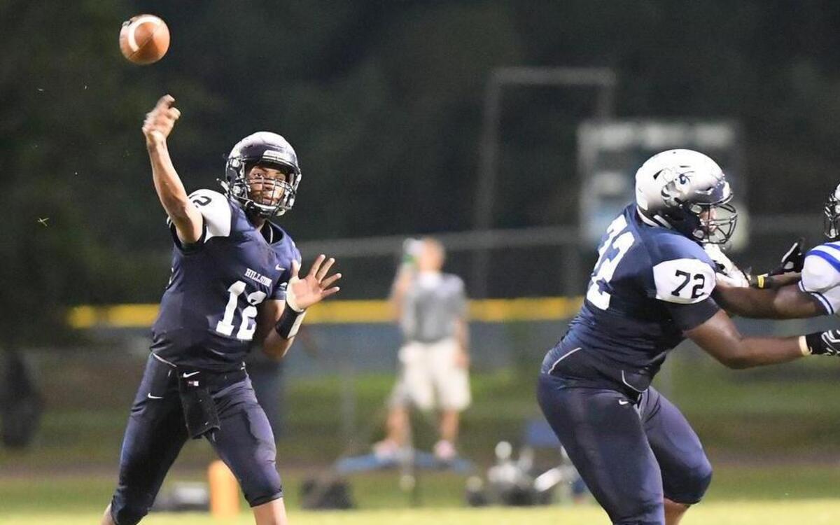 Randy Trice (12) of Hillside throws a pass during the second half. The Hillside Hornets played the Scotland Fighting Scots in a football game that took place in Durham, N.C. on Friday, August 26 2017. Scotland won 34-21.