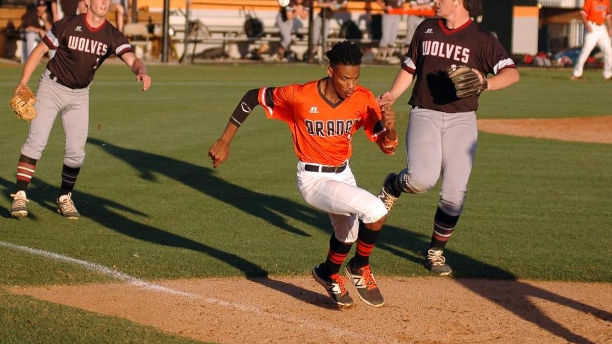 Orange's Rodney Brooks runs to first as Cedar Ridge Simon Little (left) tosses the ball to teammate Chris Cox on Tuesday, May 2, 2017. Orange won 9-1.