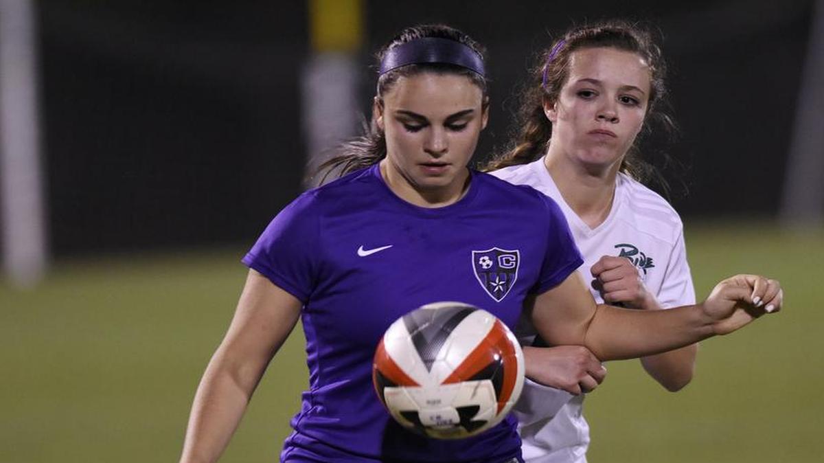 Carrboro's Alexa Wojnovich (7) and Leesville Road's Meaghan Robinson (19) go after the ball in Raleigh, N.C. on Wednesday, March 8, 2017. Leesville Road won 3-0.