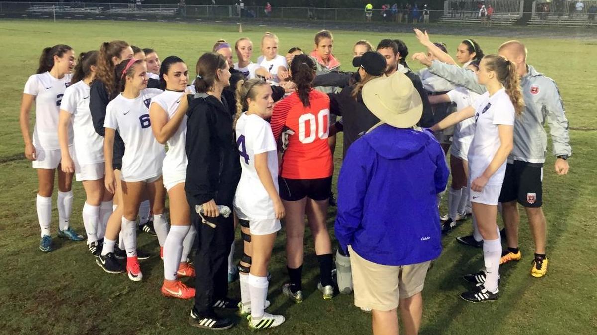 Carrboro's girls' soccer team gathers at midfield after defeating Dixon 2-1 on Tuesday, May 23, 2017 to win the N.C. High School Athletic Association 2-A East Region championship on. Carrboro earned its third straight title berth and will play on Saturday.