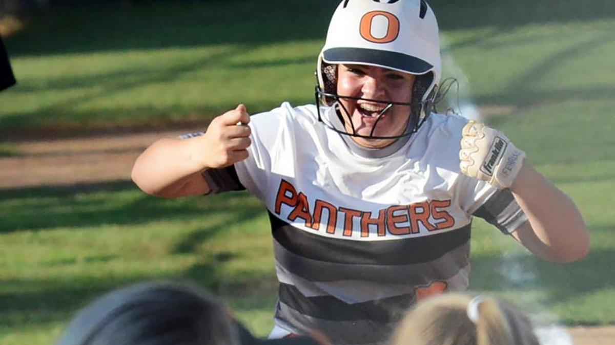 Orange's Olivia Ruff celebrates her grand slam against West Brunswick at Orange High School.