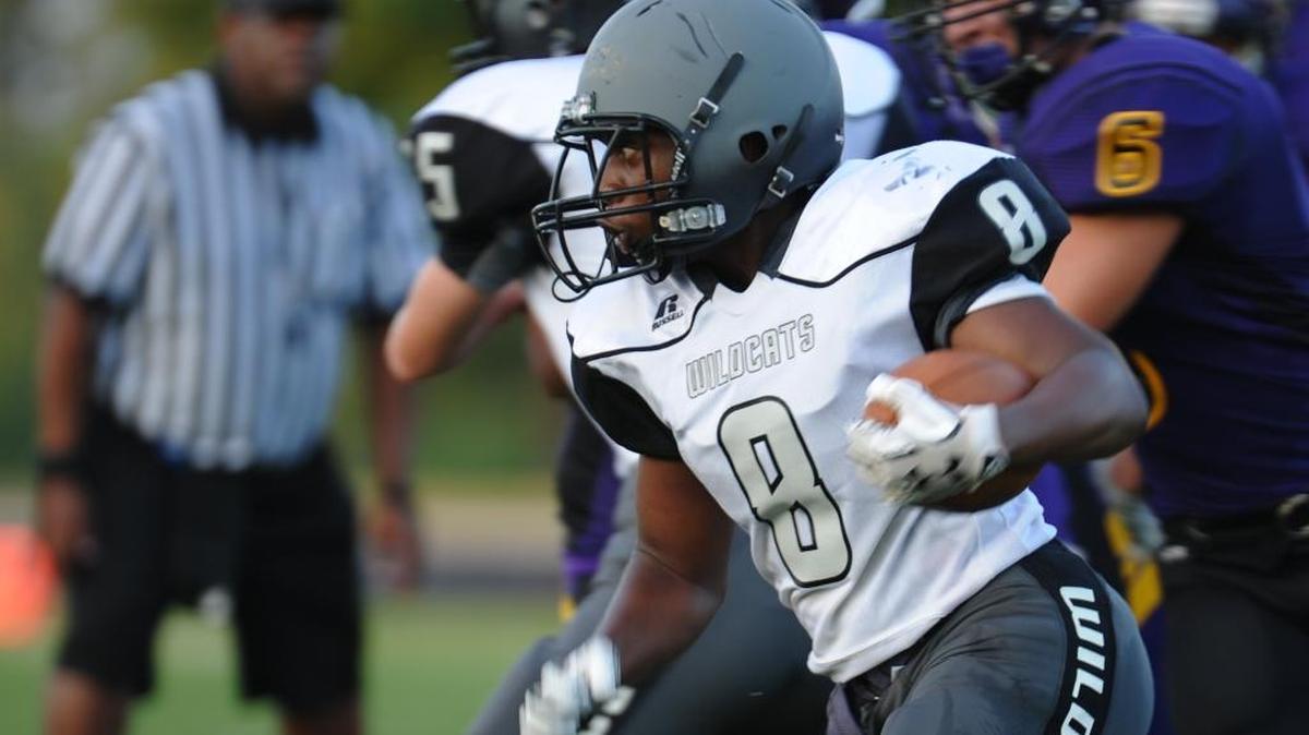 Kyreae Singleton (8) carries the ball during the JV football game between the East Chapel Hill Wildcats and the Carrboro Jaguars, which was played in Carrboro on Thursday, August 24, 2017.