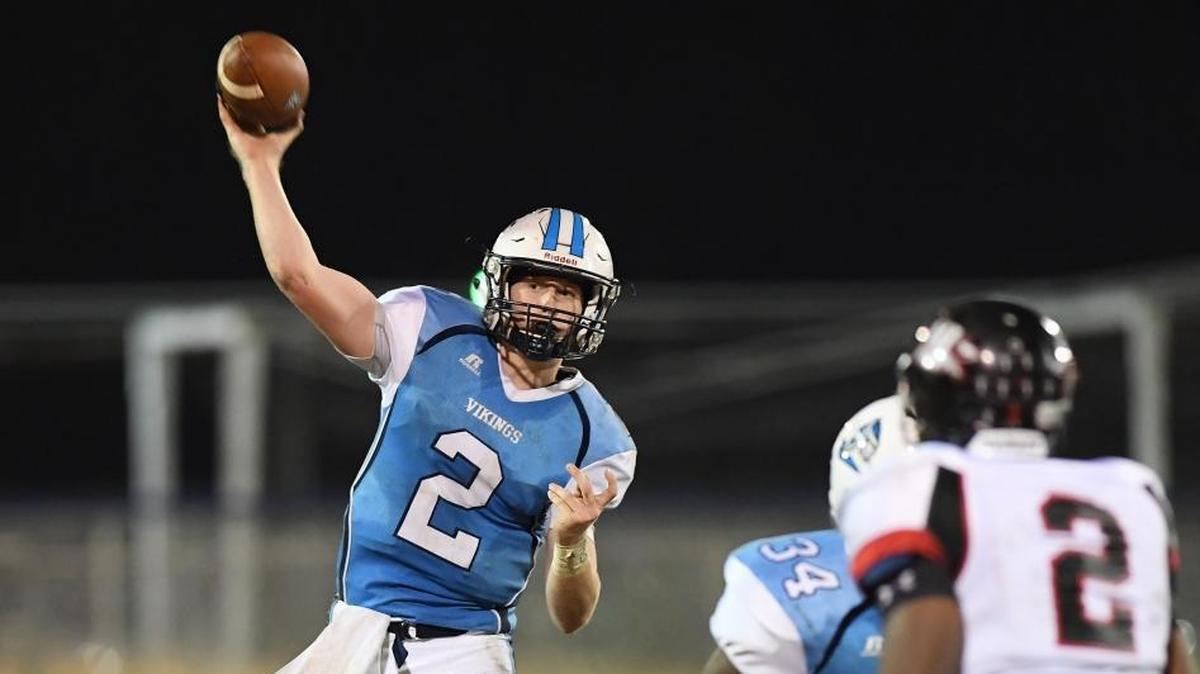 Tucker Brown, left, of South Granville throws a pass against Jaquan Brandon, right, of J.F. Webb. The J.F. Webb Warriors visited the South Granville Vikings in a high school football game on Nov. 3, 2017.