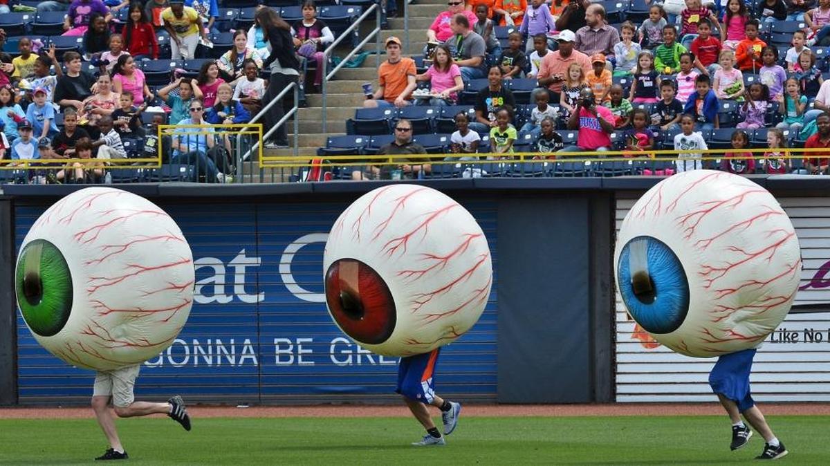 Several thousand school children from around the Triangle watched as members of the Durham Bulls promotion team perform the "Laser Eye Care Center Eyeball Race" on May 8, 2013 in Durham. Dancing eyeballs are not a feature of Buies Creek Astros games.