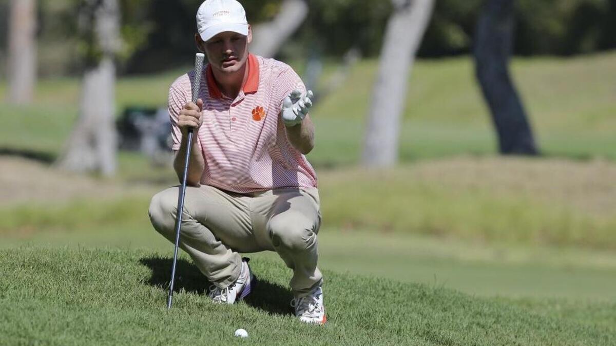 Doc Redman lines up a shot on the 16th hole during the championship round of the USGA Amateur Golf Championship on Sunday. Redman, who’s from Raleigh, is a sophomore at Clemson.