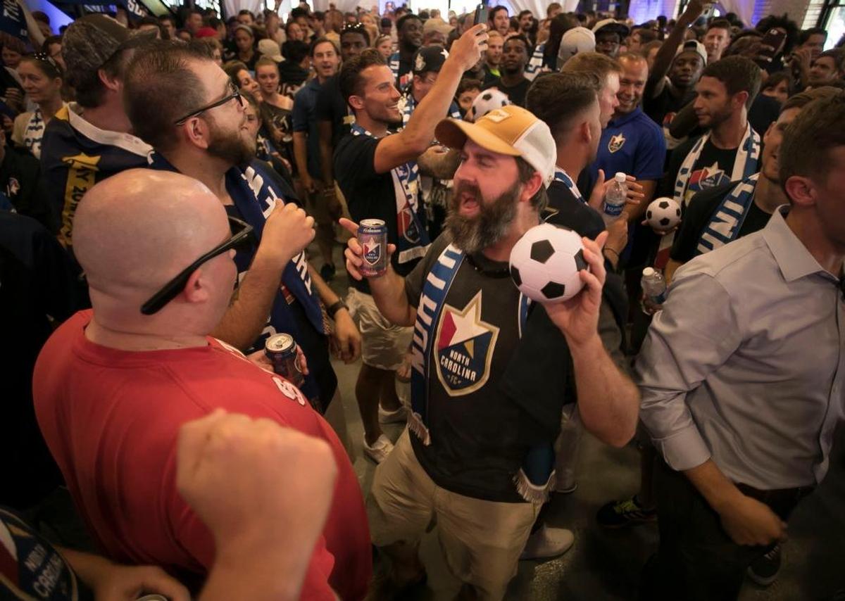 Joe Johnson of Raleigh was part of several hundred soccer fans that took part in a rally at the City Market to promote Raleigh as an MLS expansion city on Wednesday.