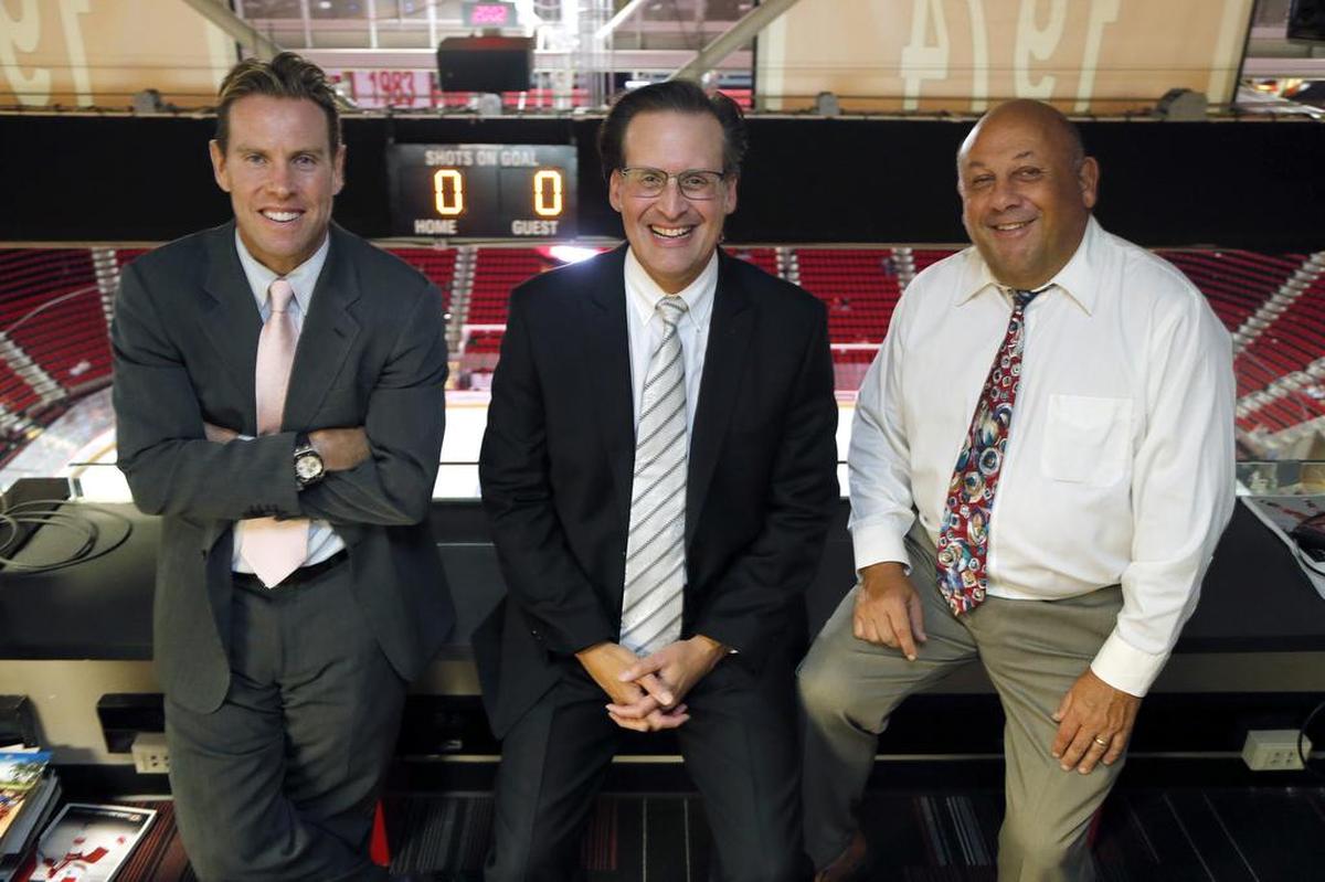 The Carolina Hurricanes broadcast team, Tripp Tracy, left, (TV), John Forslund, center, (TV) and Chuck Kaiton (Radio) before an NHL preseason game played between the Carolina Hurricanes and the Tampa Bay Lightning at the PNC Arena in Raleigh, N.C. on Sept. 30, 2016.