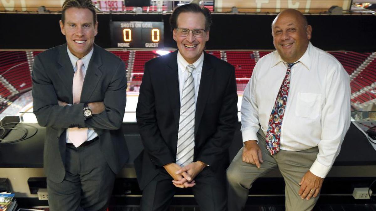 The Carolina Hurricanes broadcast team, Tripp Tracy, left, (TV), John Forslund, center, (TV) and Chuck Kaiton (Radio) before an NHL preseason game played between the Carolina Hurricanes and the Tampa Bay Lightning at the PNC Arena in Raleigh, N.C. on Sept. 30, 2016.