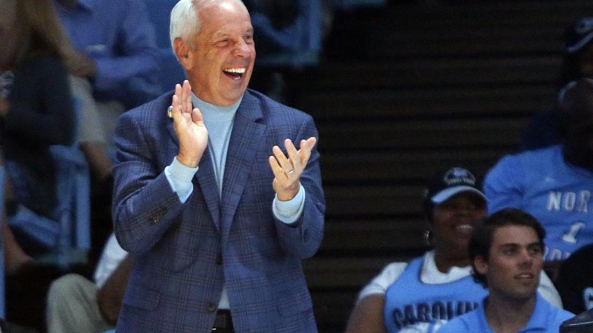 Roy Williams is entertained by one of the player skits as the UNC Tar Heel basketball team has its annual "Late Night with Roy" event to open the college basketball season at the Dean Smith Center in Chapel Hill, NC, on Oct. 13, 2017.