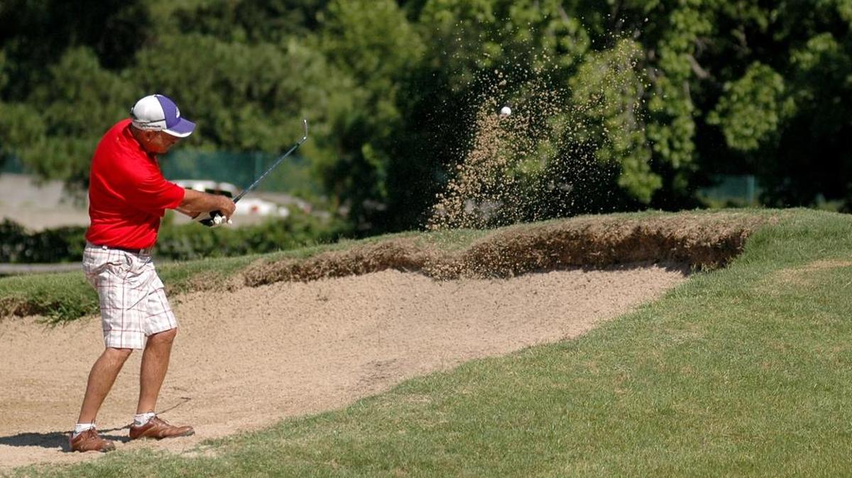 Ron Briggs hits out of a sand trap on Saturday, June 24, 2017 during his semifinal match at Hillandale Golf Course.